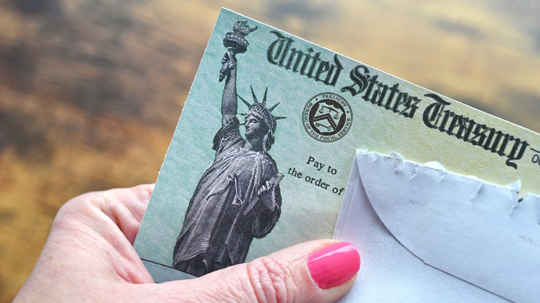hand holding a Social Security check