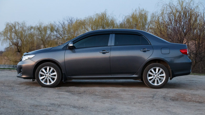 Toyota Corolla gray color on the Samara river bank in twilight