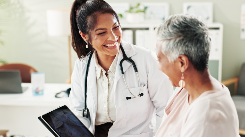 senior talking to her doctor