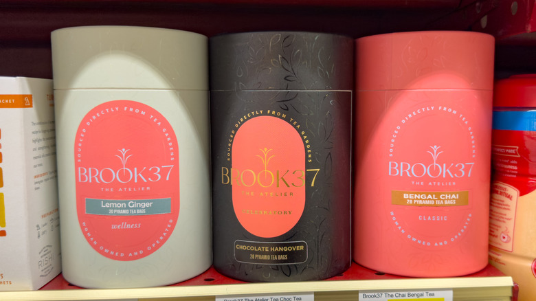Three cylinders of Brook37 tea in different colors and varieties.
