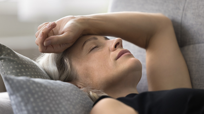 woman bored on a couch