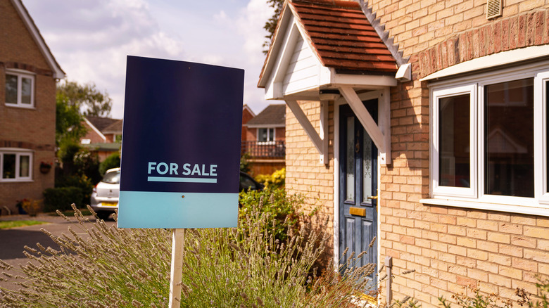 For sale sign in front of a house
