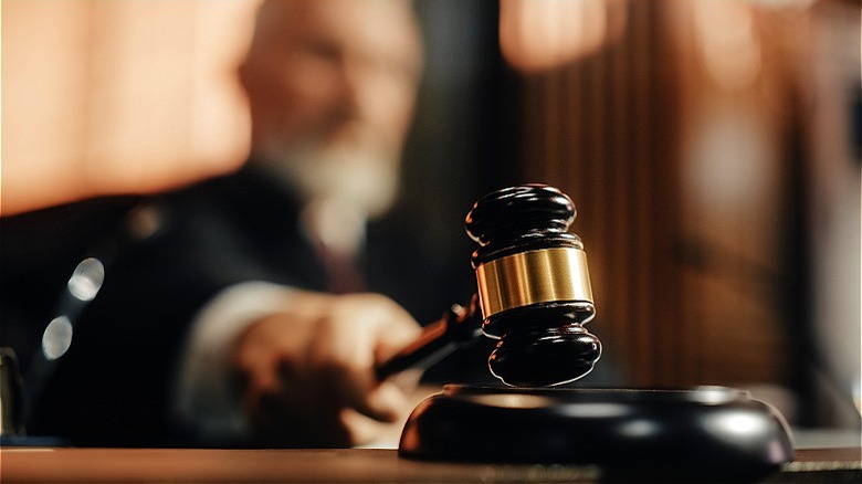 Close-up of judge pounding gavel