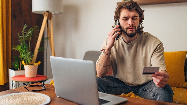 Person on phone discussing card