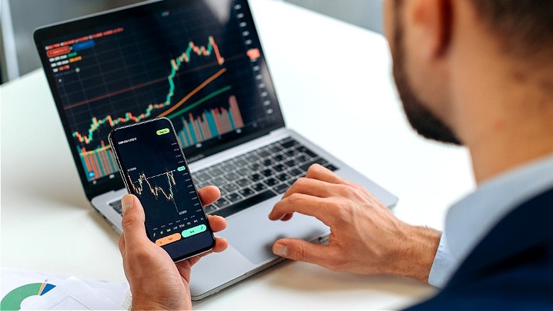Person monitoring stock market prices
