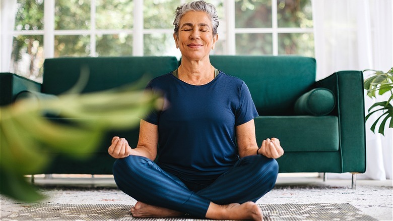 Older person meditating at home
