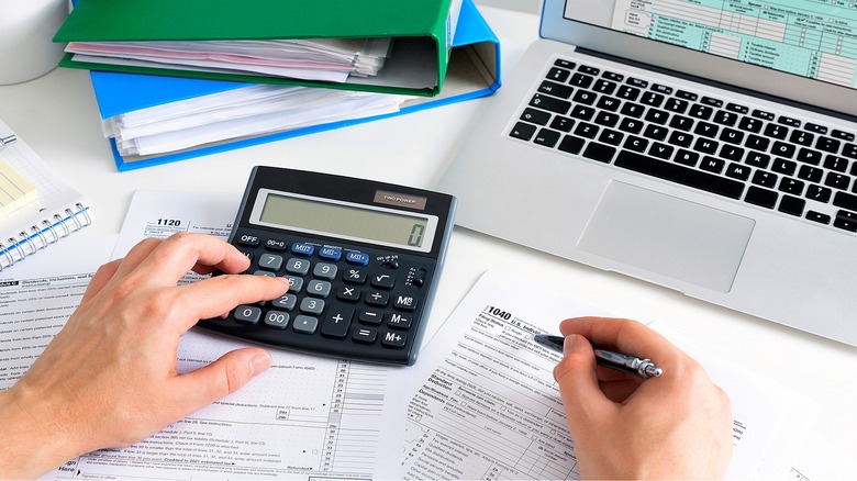 Person calculating taxes, Form 1040