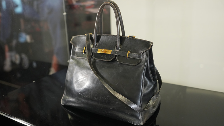 Shot of original Birkin bag sitting on platform at auction