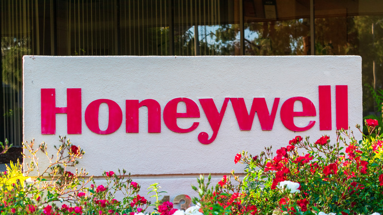 Honeywell sign surrounded by flowers outside one of its corporate buildings