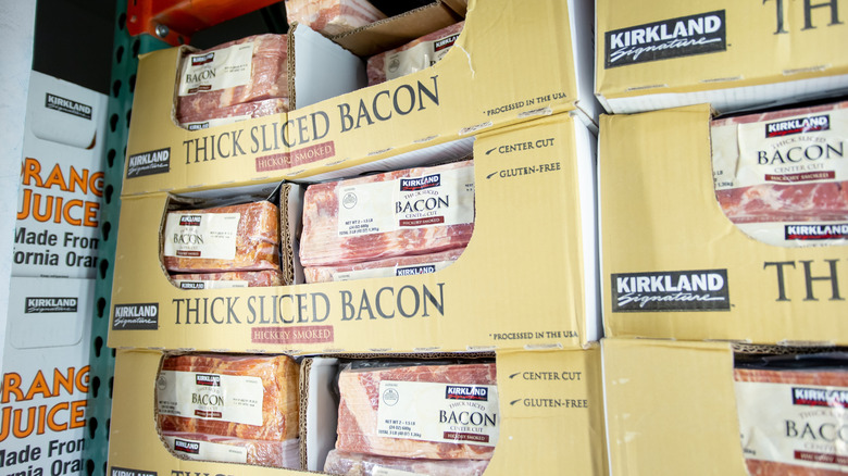 A medium shot of Kirkland Signature thick sliced bacon packages.