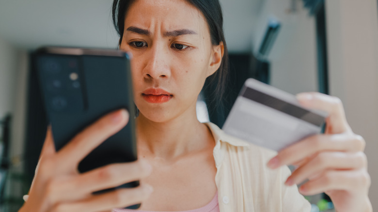 A woman looking at her phone