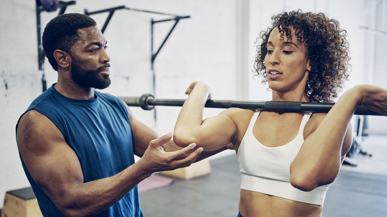 A personal trainer with client