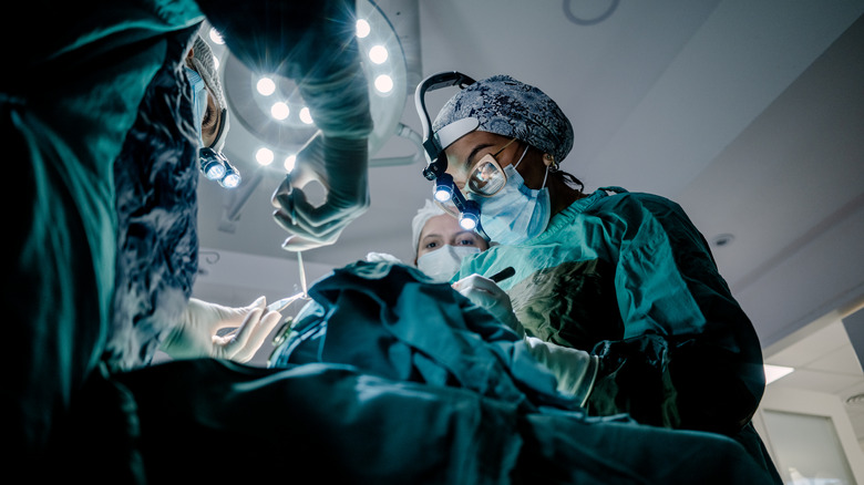 view from below of surgeons during procedure
