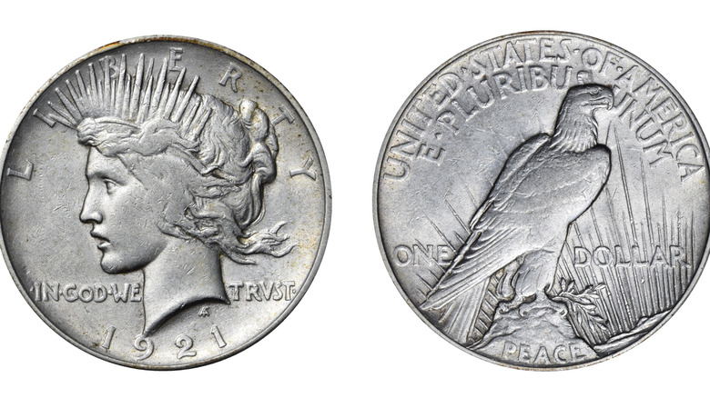Front and back sides of a Peace Dollar coin from 1921