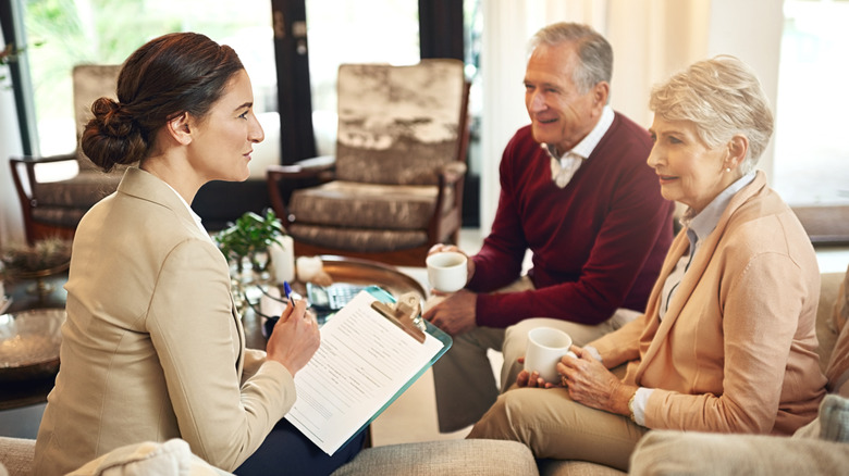 Retirees meet with financial planner.