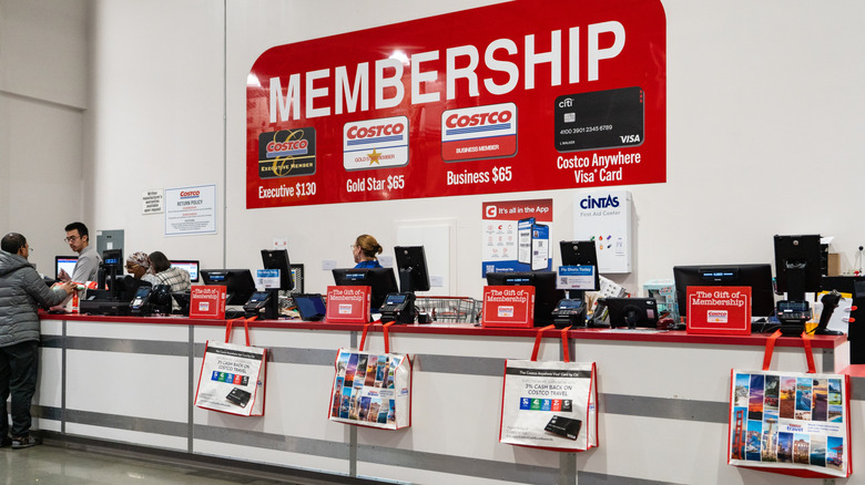 Costco staff manning the membership desk