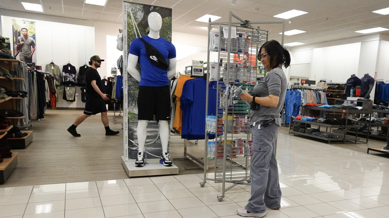Female worker restocking the shelves in Miami, Florida Kohl's location
