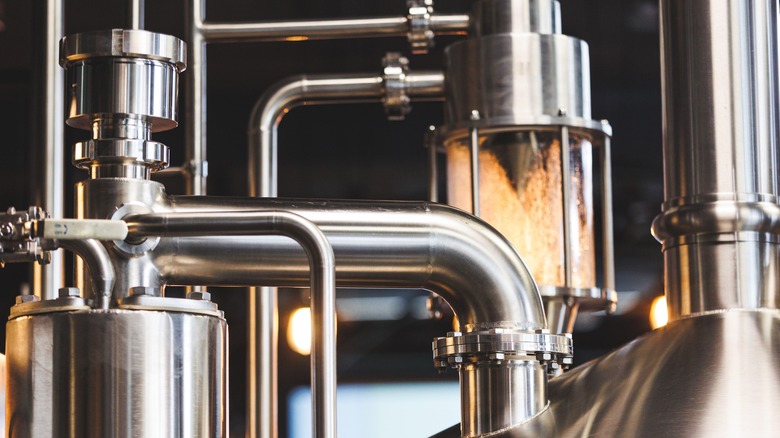 A close up of metal brewery equipment