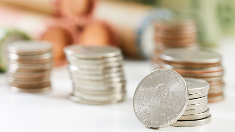 Stacks of nickels on table