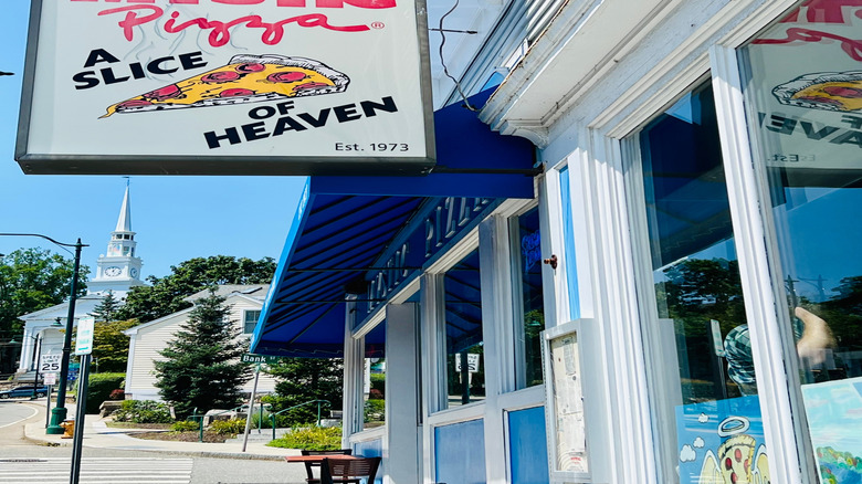 The famous Mystic Pizza hanging sign outside of the titular pizza spot in Mystic, CT.
