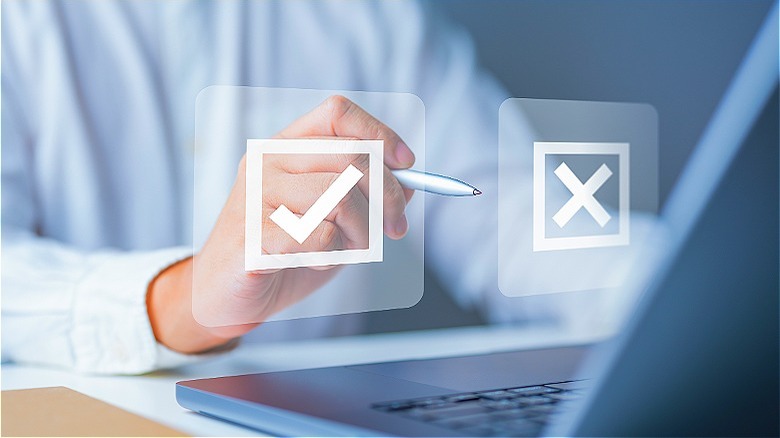 Person making decision on laptop