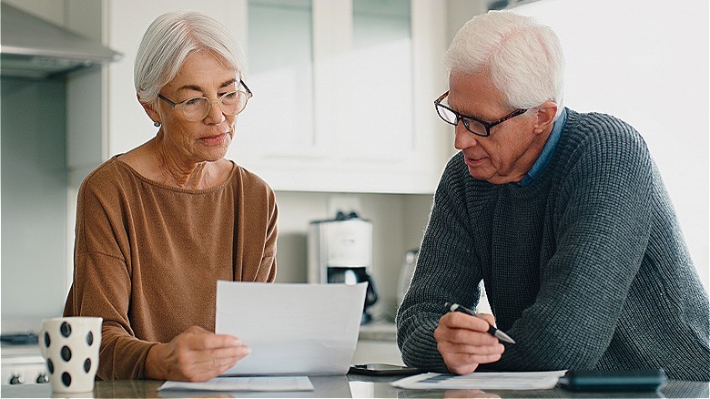 Two people reviewing paperwork