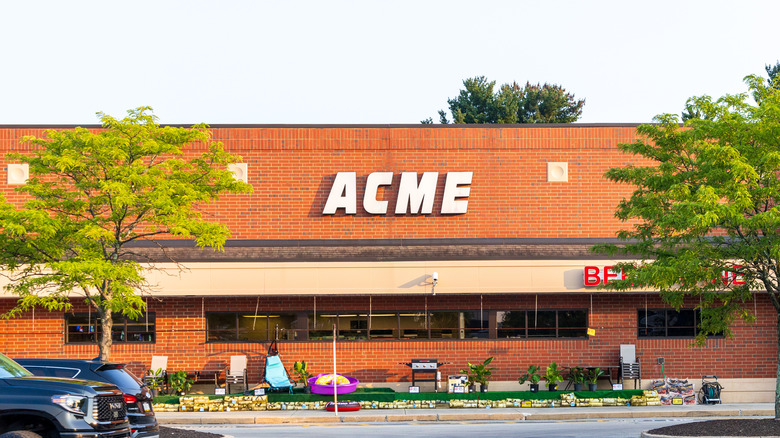 A brick building with a sign that says Acme on it.