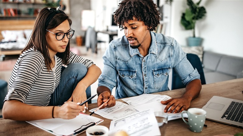 Couple discussing budget at home