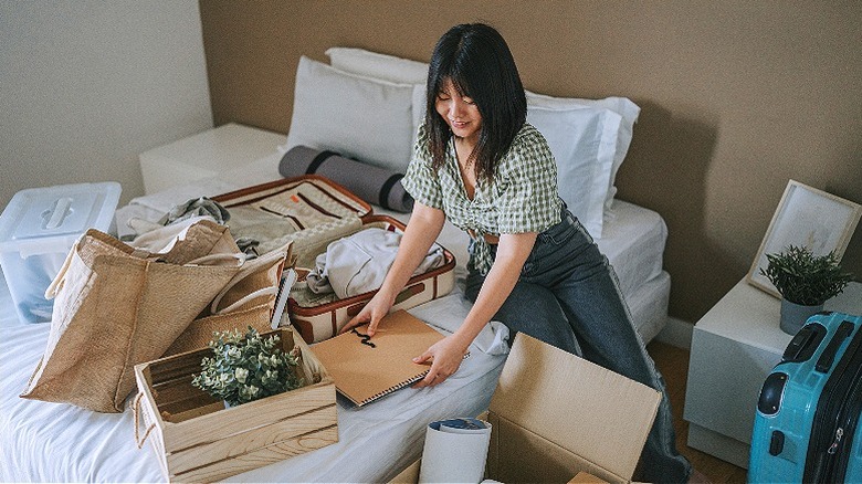 Person placing items in boxes