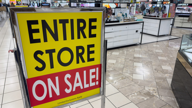 Entire Store on Sale signage inside a Macy's department store.