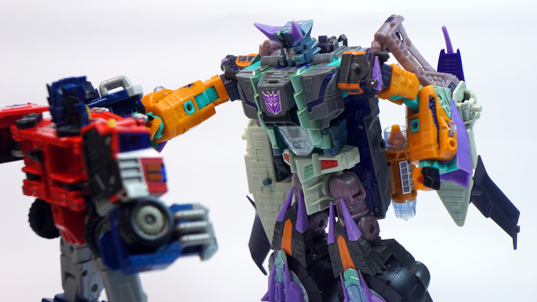 Megatron action figure with other Transformer toy