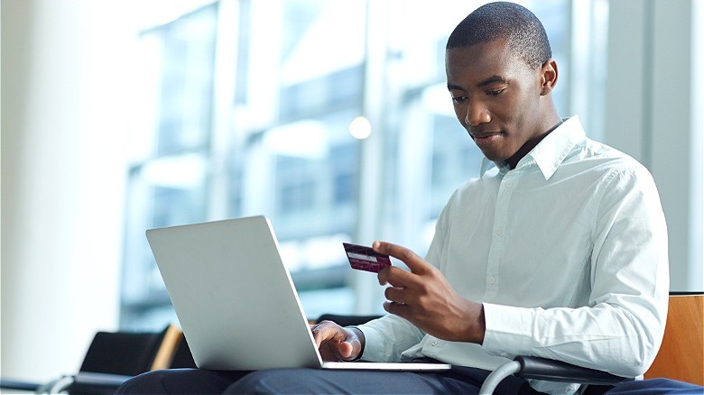 Person looking at credit card
