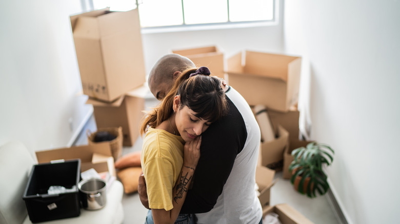 Two people packing up to move