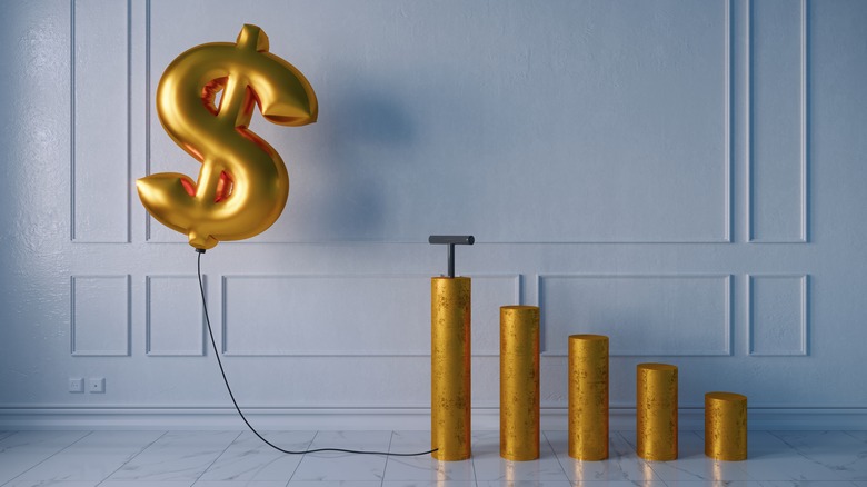 money balloon being pumped up