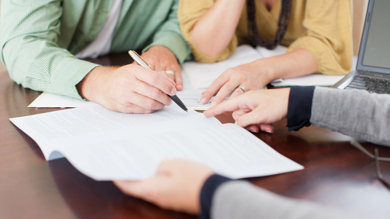 signing papers for business loan