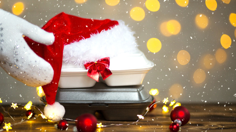 Santa hat on boxes of takeout foot