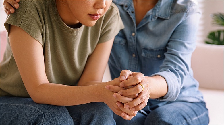 Person comforting another person