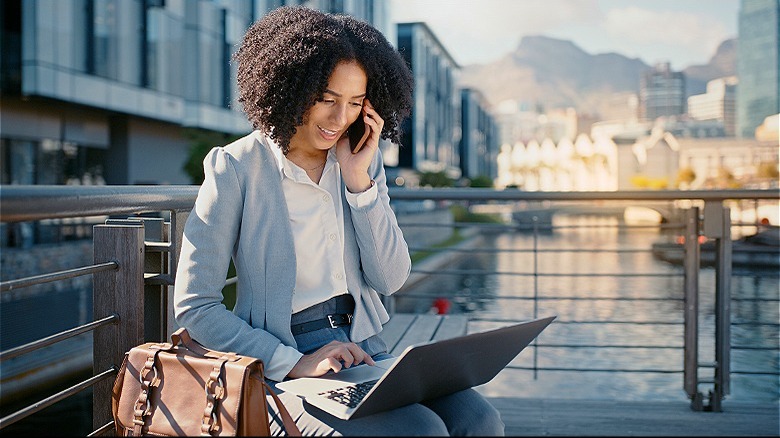 Person on phone working outside