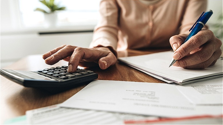 Person calculating from paperwork