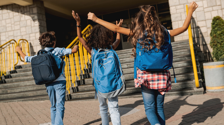 young students walking to school
