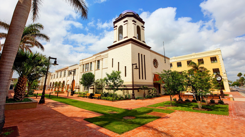 spanish style building with trees and sky