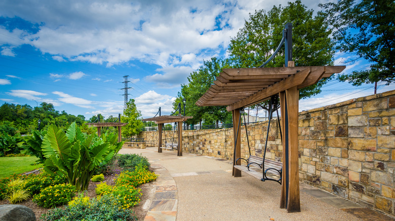 A walkway, bench and gardens at Elizabeth Park, in Elizabeth City North Carolina.