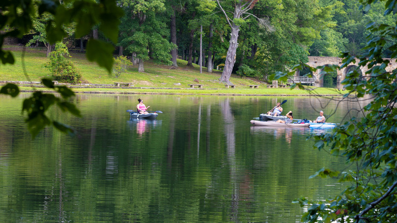 People boating in Byrd Lake at Cumberland Mountain State Park in Crossville, Tennessee