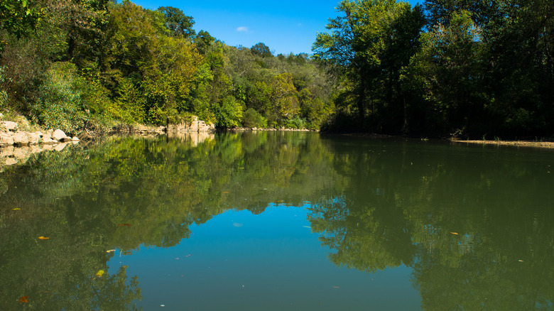 Blue sky reflected on Harpeth River in Kingston Springs, Tennessee