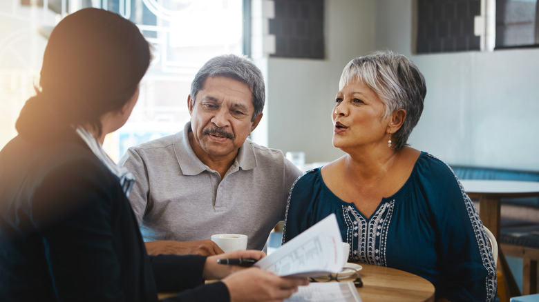 Senior couple talking with a lawyer