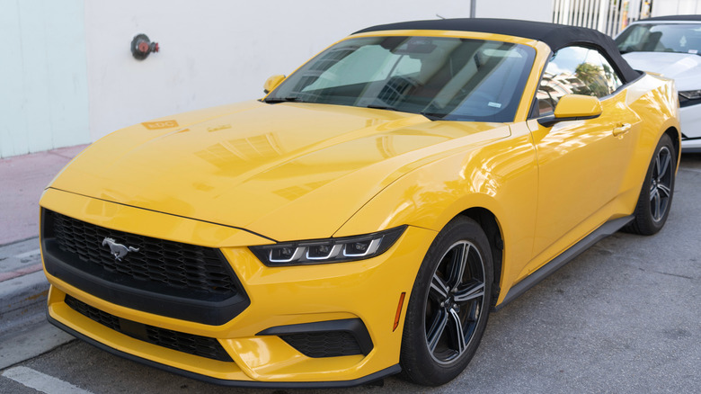 A yellow 2024 Ford Mustang EcoBoost convertible car