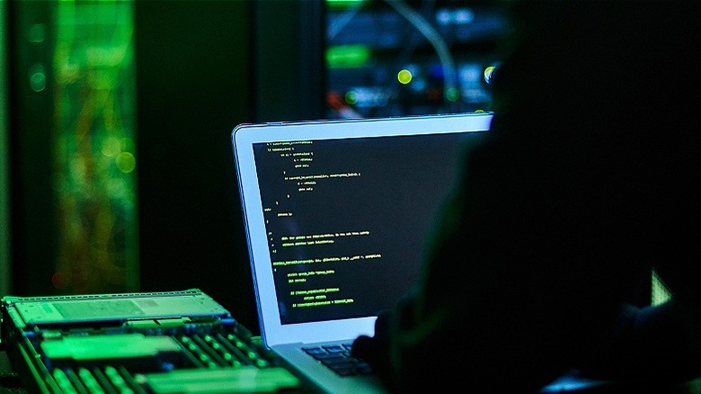 Hacker working on computer