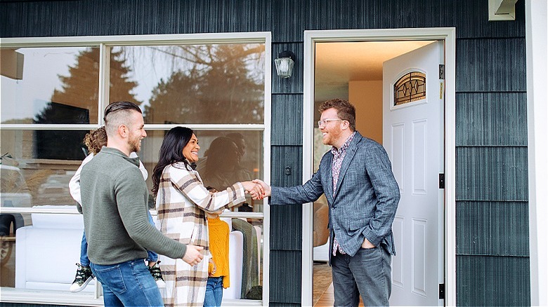 Real estate agent showing home