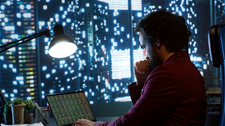 Person using laptop at night