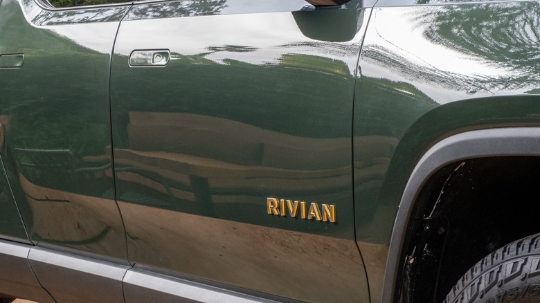 Side profile of Rivian R1T showing the Rivian logo and door lines at the Rivian Experience Store in Los Angeles, California.